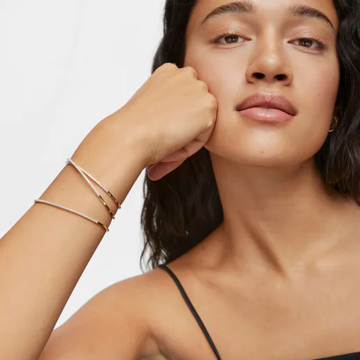 Model with Les Classiques gold and diamond bracelet