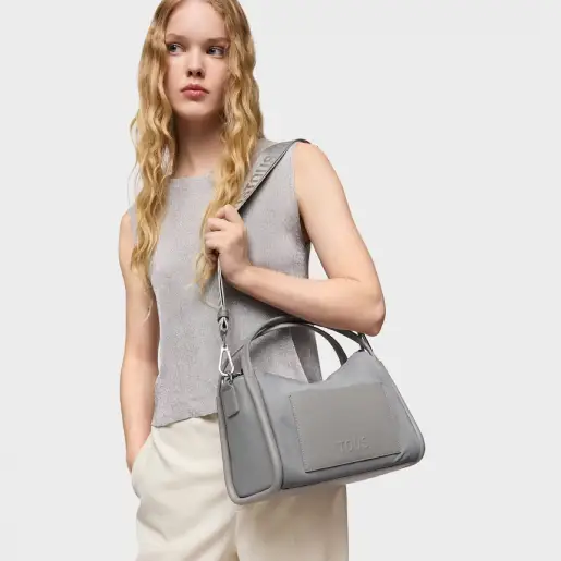 Model with grey city bag